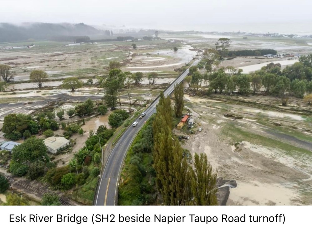Flooding through plains beside the sea. Esk River Bridge.