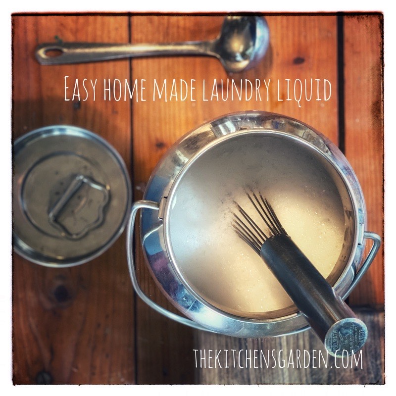 Laundry Liquid in a stainless steel bowl with lid and ladle to the side