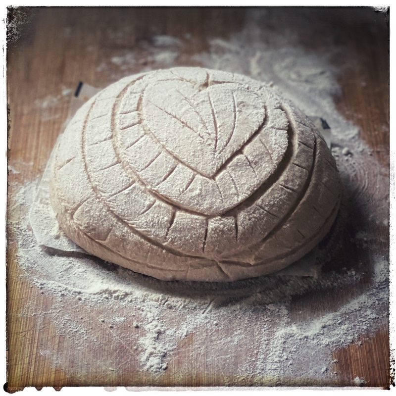 Scoring on Red Fife loaf of bread with heart scoring. Flour from Janies Mill