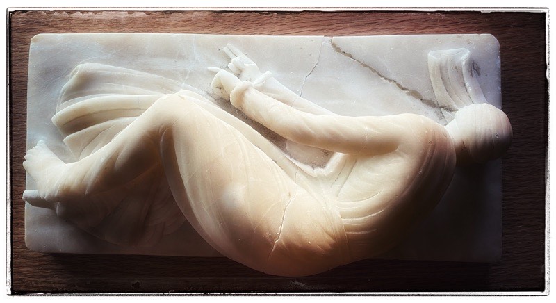 Saint Cecilia broken and being repaired. 