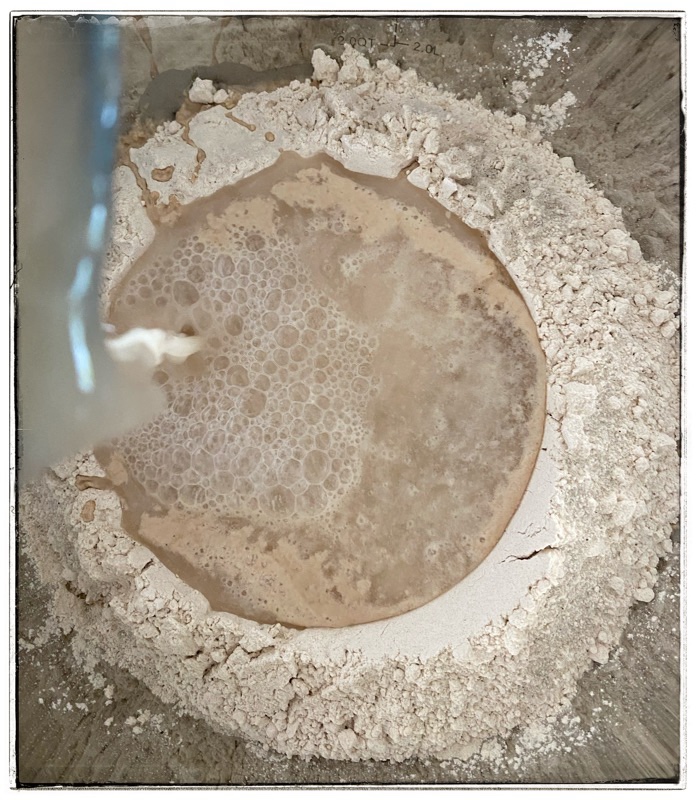 Pour water into flour