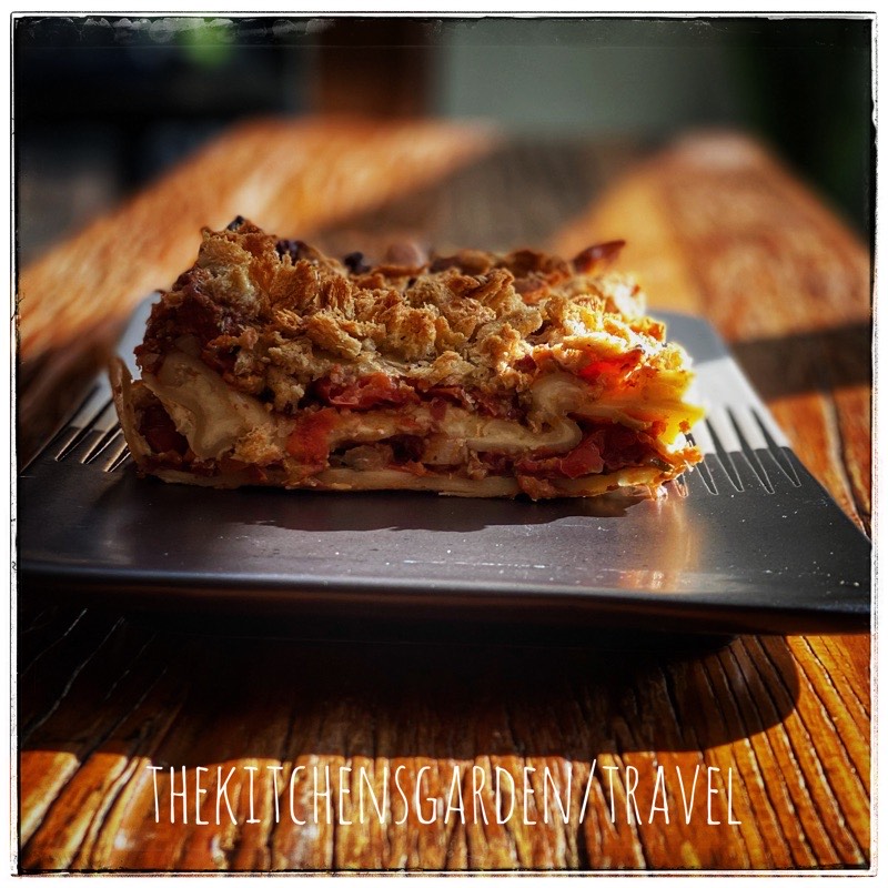 vegetarian lasagna with the words thekitchensgarden/travel