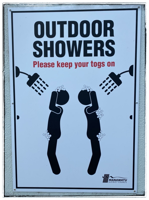 sign - wear your togs in the shower