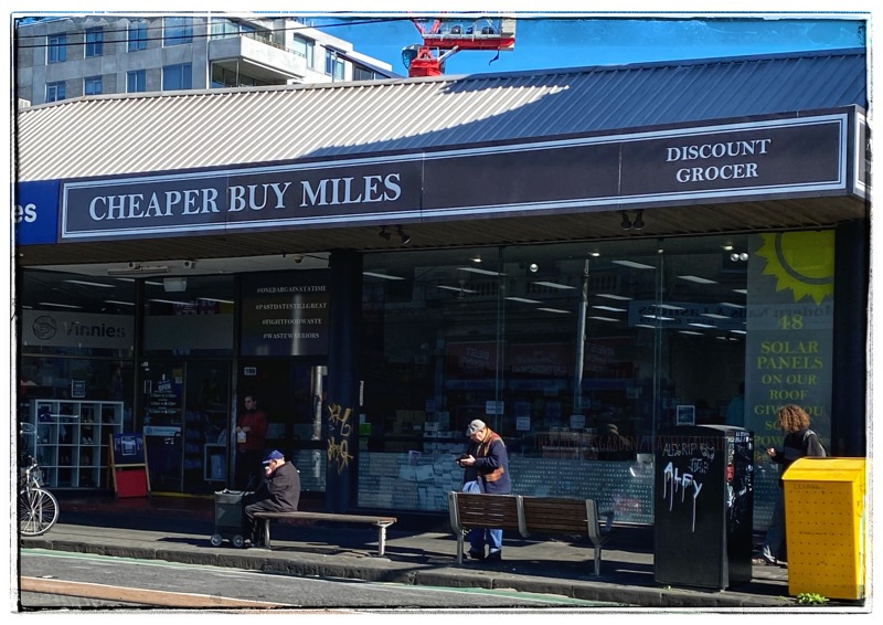 cheaper buy miles road sign