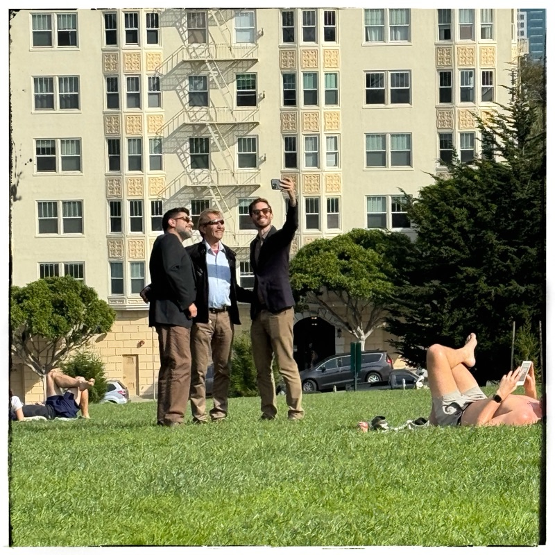 Three men taking selfie 
